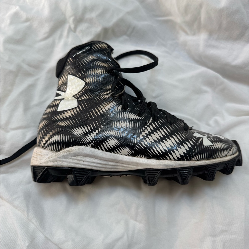 Under Armour Kids Black and White High Top Cleats for football, soccer